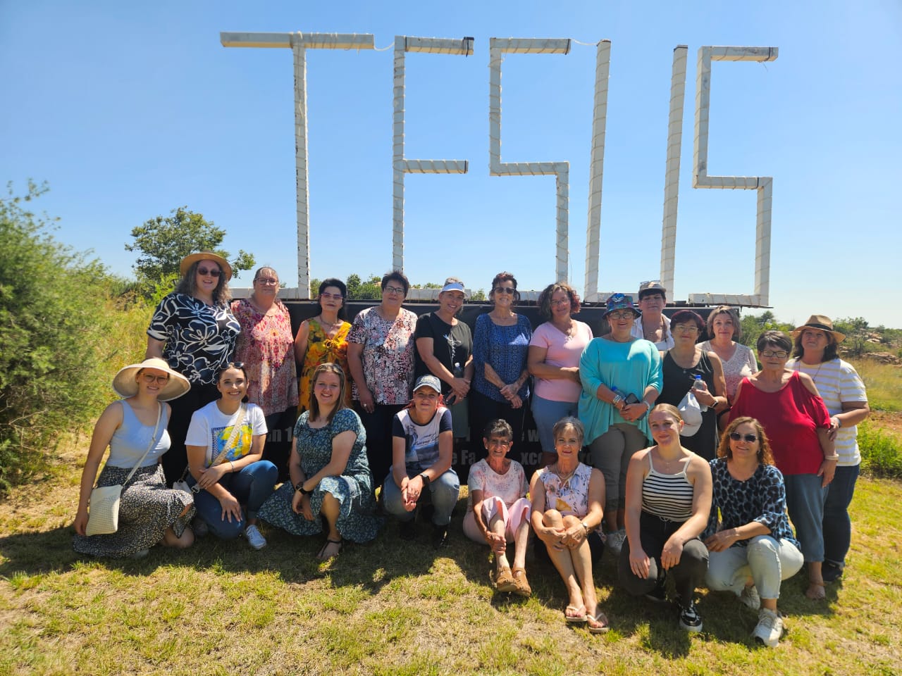 Ladies' group photo at the JESUS sign