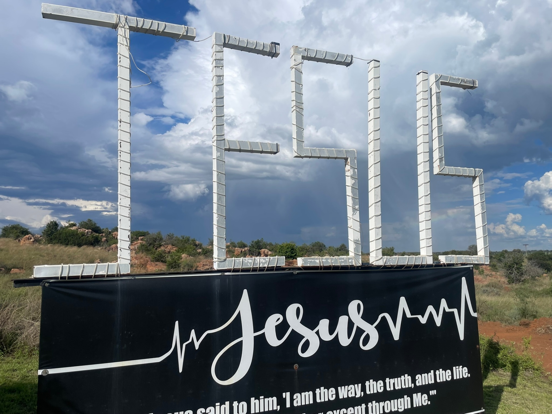 Close-up of the JESUS sign with John 14:6 banner