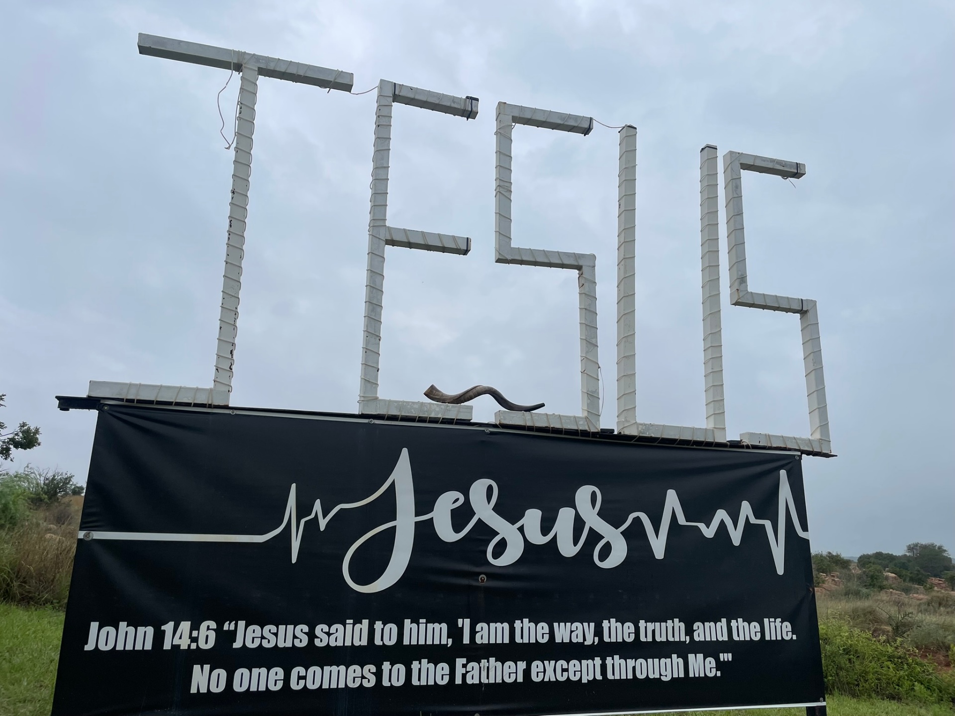 JESUS sign with shofar resting on the platform